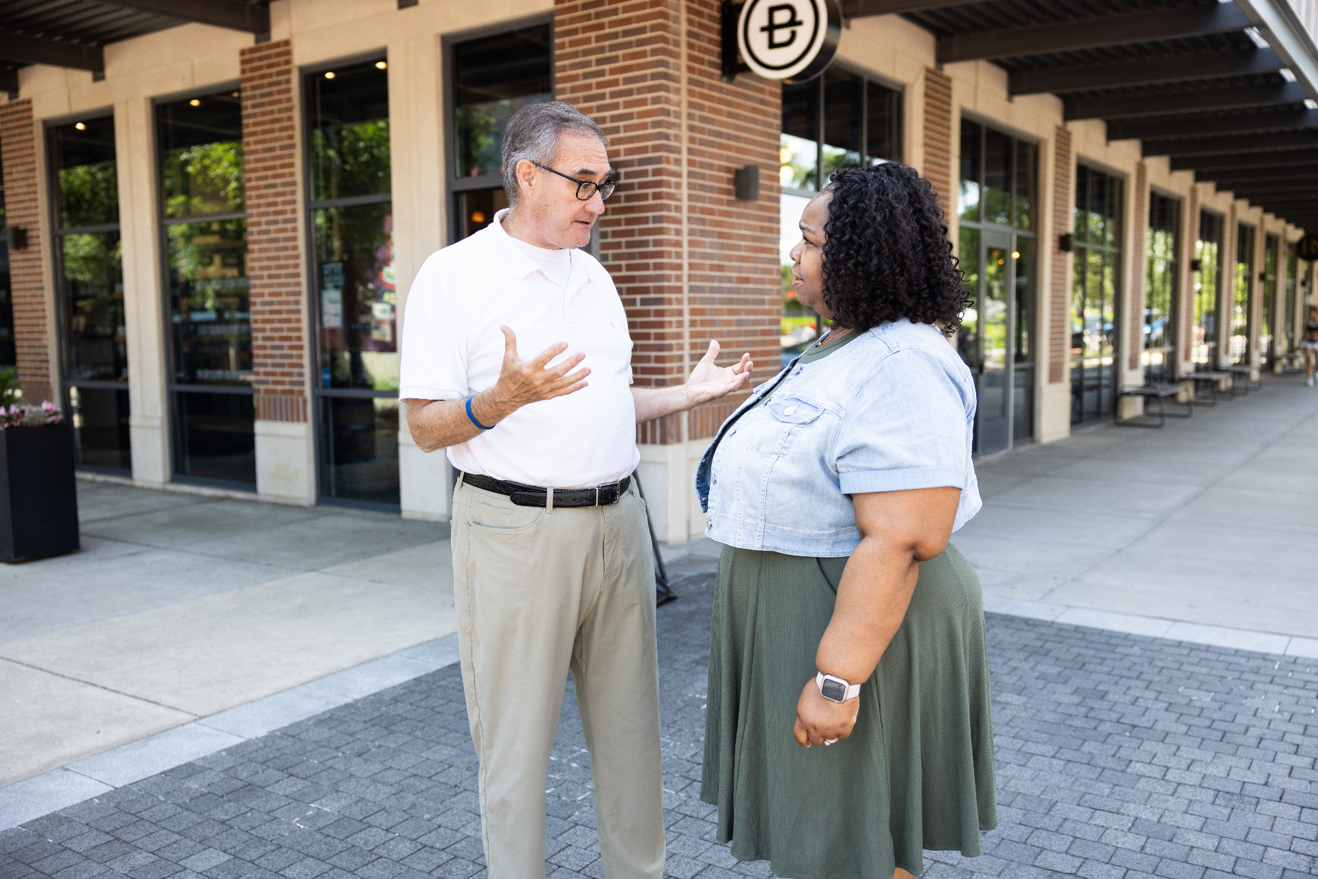 John Ruckelshaus shaking hands with a community member